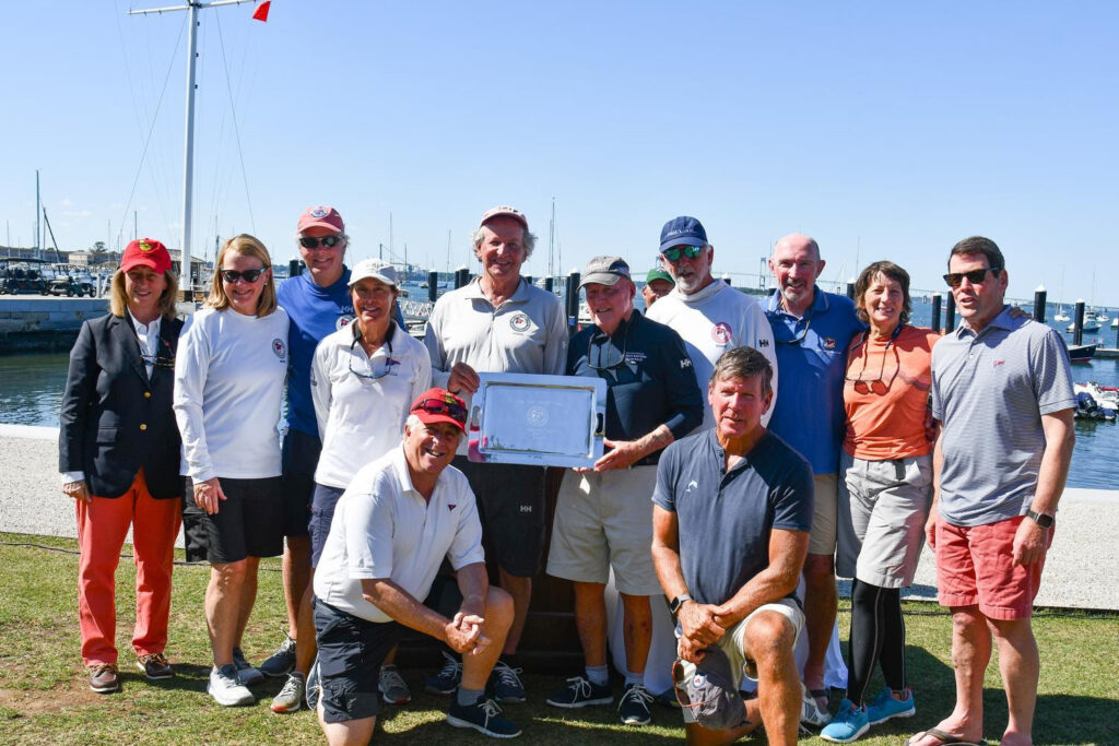 (Left to right): Vice Commodore Clare Harrington, Martha Altreuter, Chip Whipple, Lynne Whipple, Steven Wolff, Ted Moore (skipper and co-captain), Past Commodore George Hinman (skipper and co-captain, Bill Tripp (skipper), Sam Altreuter, Past Commodore Phil Lotz, Danielle Tripp and Peter Benedetto [not pictured: Doug McKeige].